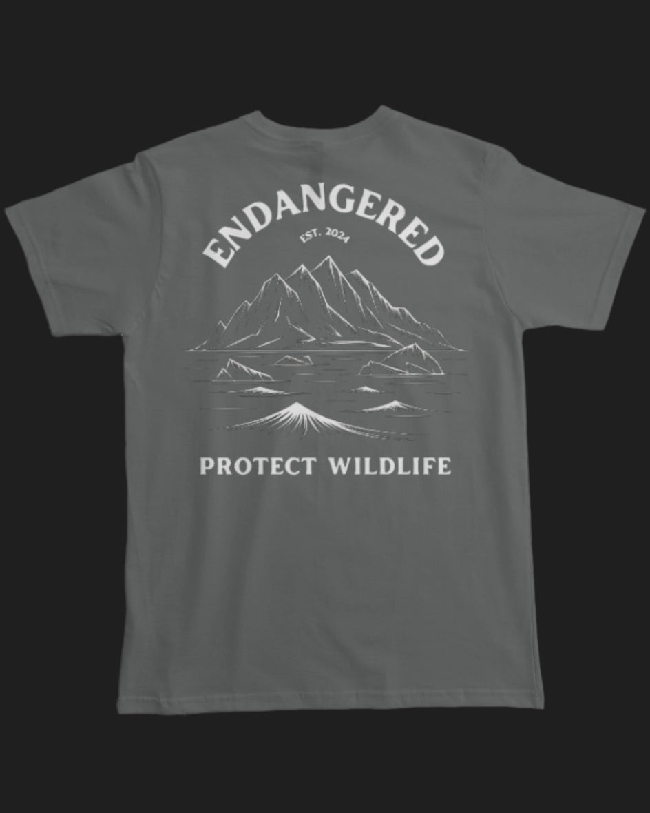 Gray t-shirt with mountain graphic and 'Endangered Protect Wildlife' text on a white background