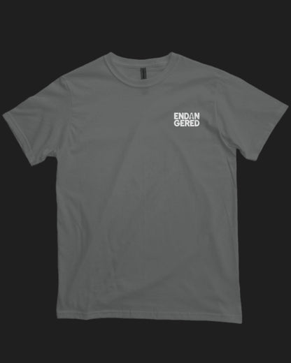 Gray t-shirt with 'ENDAN GERED' text on a black background