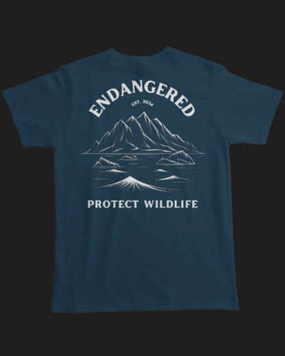 Navy blue t-shirt with mountain graphic and 'Endangered Protect Wildlife' text on a white background