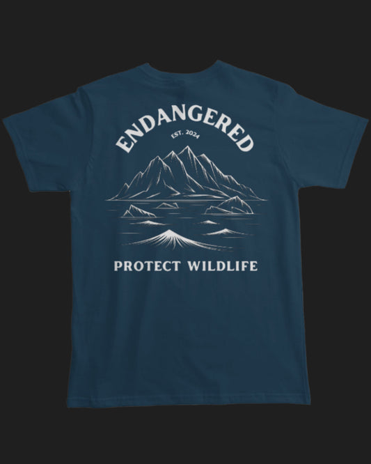 Navy blue t-shirt with mountain graphic and 'Endangered Protect Wildlife' text on a white background