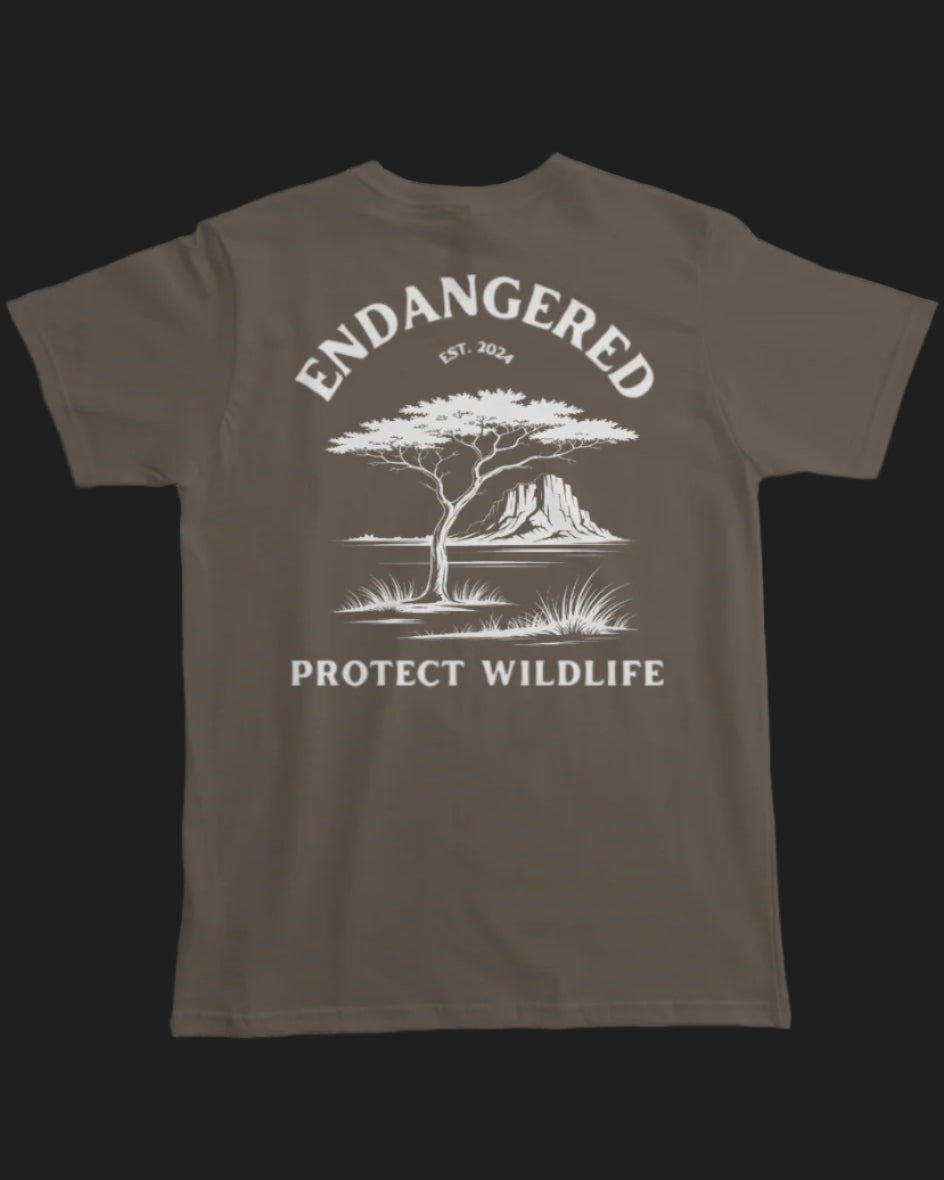 Brown t-shirt with white graphic and text 'Endangered Protect Wildlife' on a white background