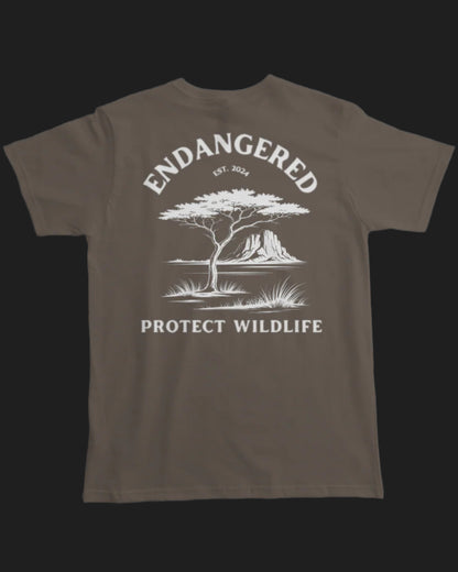 Brown t-shirt with white graphic and text 'Endangered Protect Wildlife' on a white background