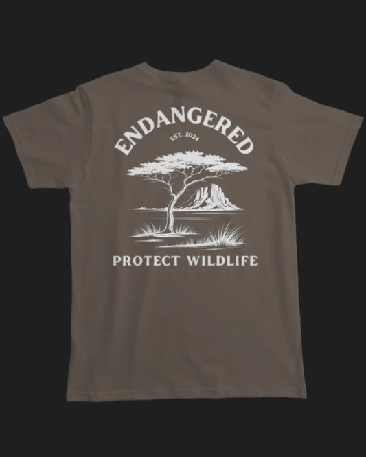 Brown t-shirt with white graphic and text 'Endangered Protect Wildlife' on a white background